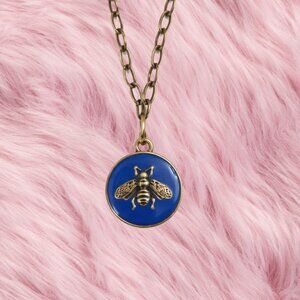 UPCYCLED  Bronze & Blue Bee Necklace.  Stamped on back of upcycled pendant.